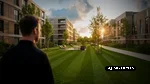 neo-werkhaus-objektbetreuung-wohnanlage Mann steht vor einer modernen Wohnanlage mit gepflegten Grünflächen und Außenbereichen.