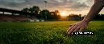 neo-werkhaus-rasenpflege-fussballplatz Eine Hand fährt über den gepflegten Rasen eines Fußballplatzes und verdeutlicht die hohe Qualität der professionellen Rasenpflege.